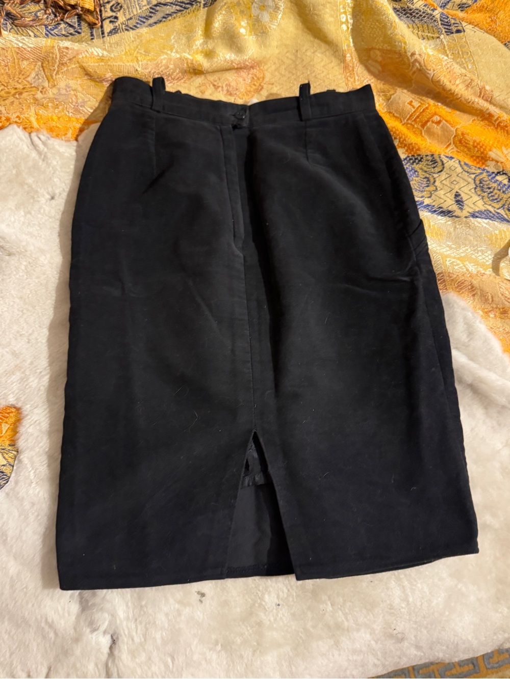 Black suede pencil skirt with cowboy stitching and slit